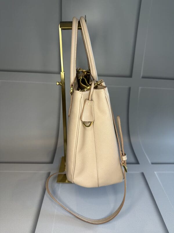 A white purse sitting on top of a tile floor.