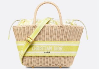 A yellow and white striped bag is on the ground